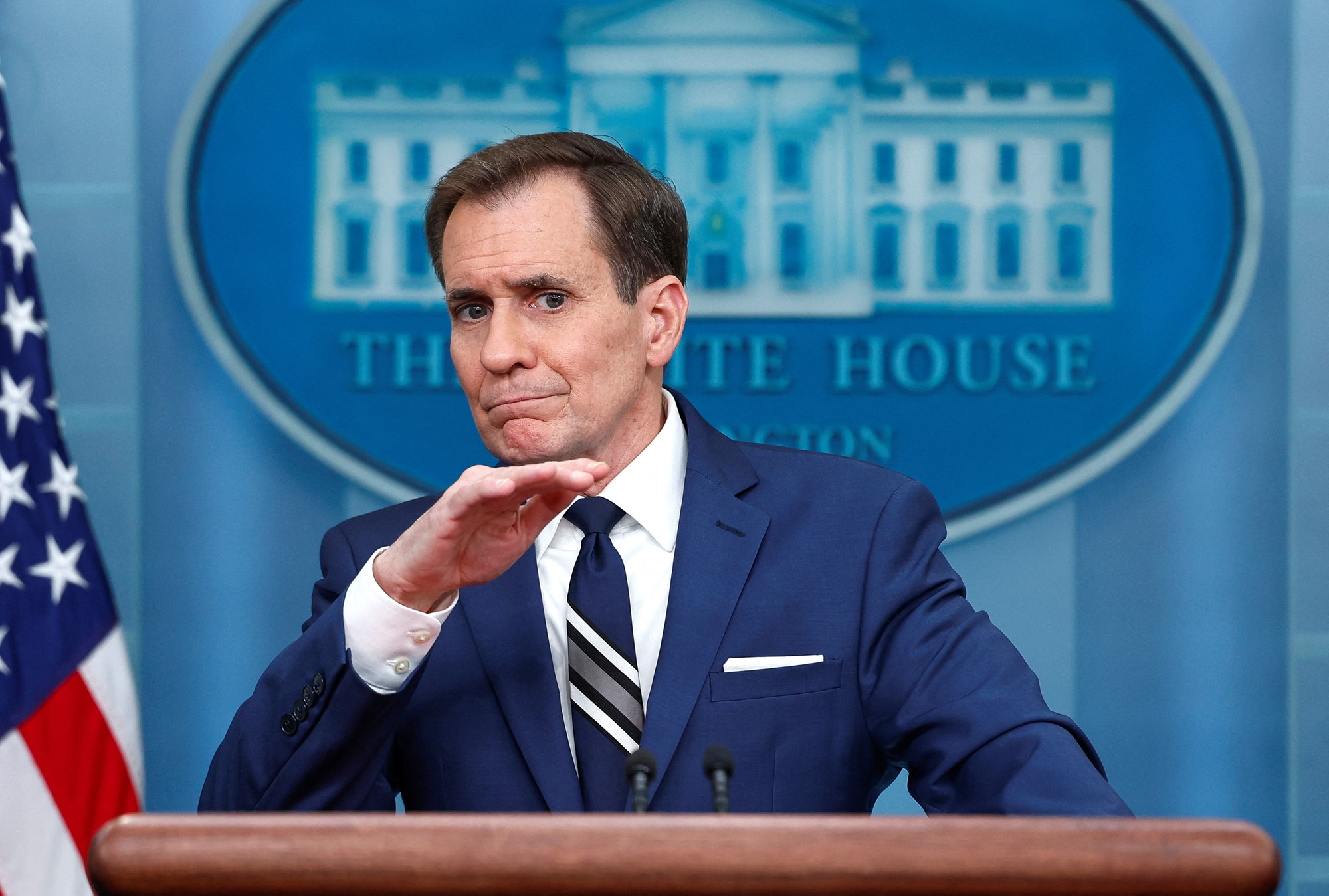 John Kirby in front of the White House logo. 