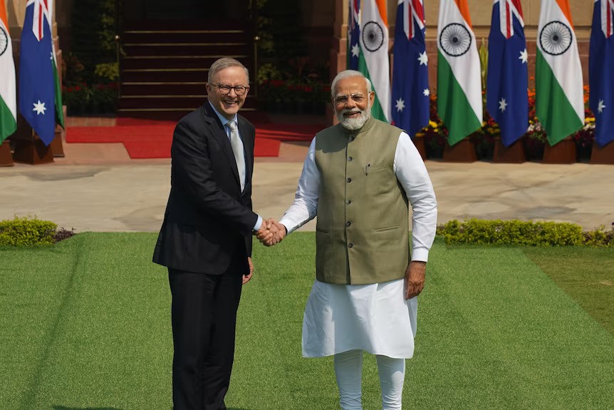 Anthony Albanese shakes hands with Narendra Modi