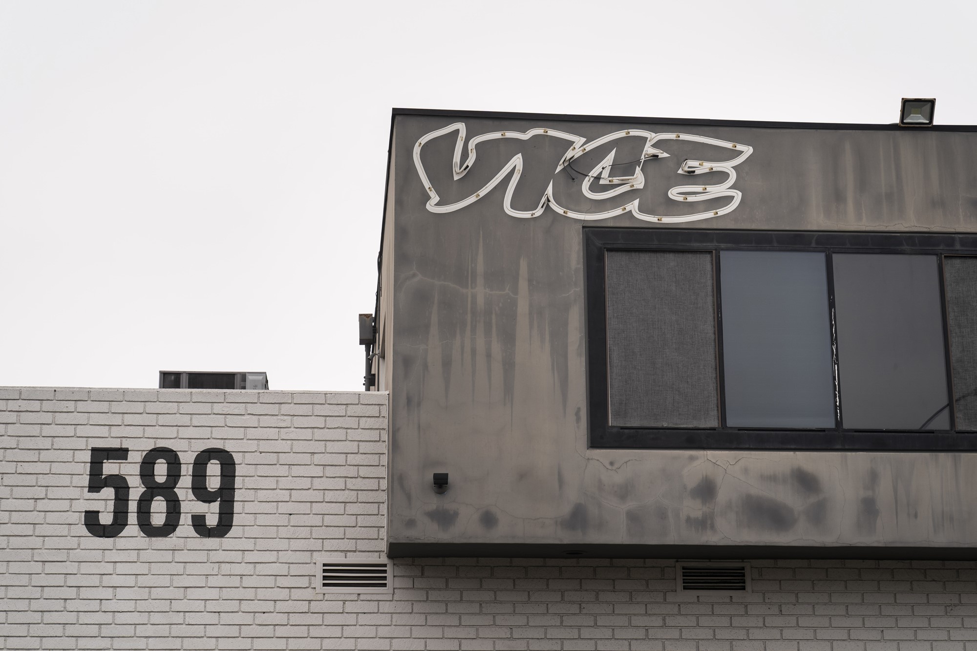 The front of a small office building with the VICE logo and the numbers 589 on its walls