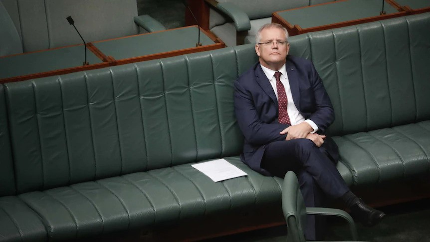 Morrison sits in parliament alone.