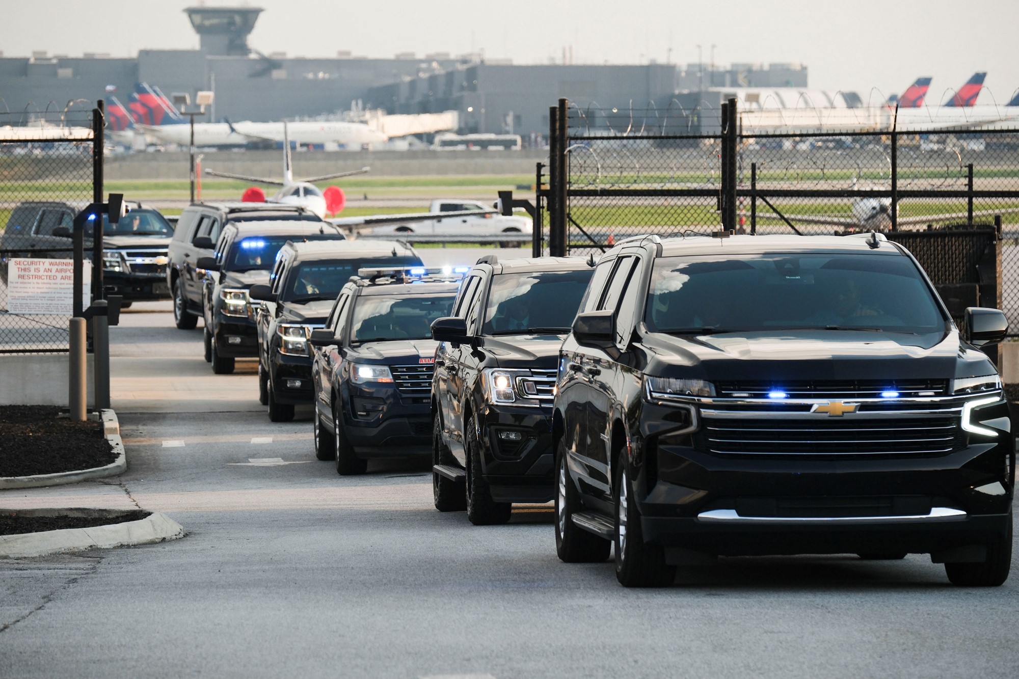 Members of security forces ride motorcycles as former U.S. President Donald Trump departs Atlanta Hartsfield-Jackson International Airport