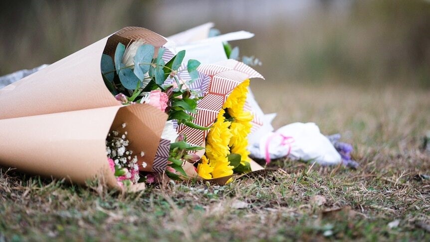 Flowers are placed on the ground.