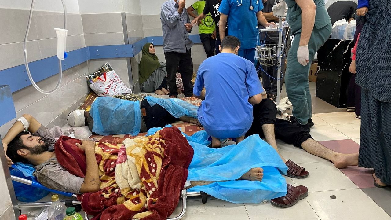 An image of people lying on a hospital floor while being treated