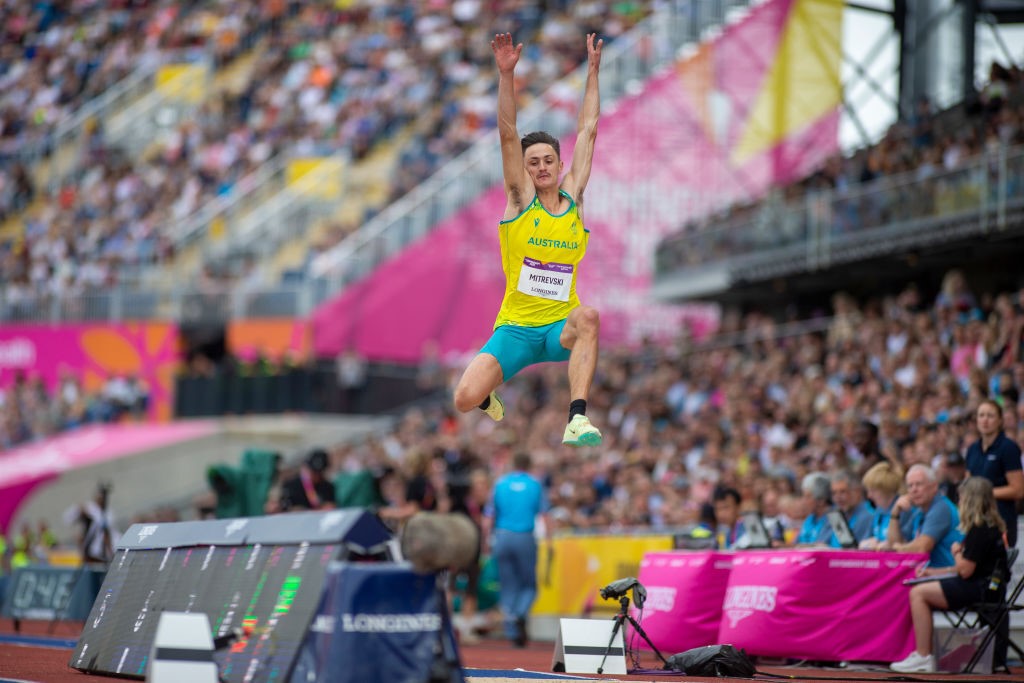 Chris Mitrevski in the air during the Commonwealth Games long jump final.