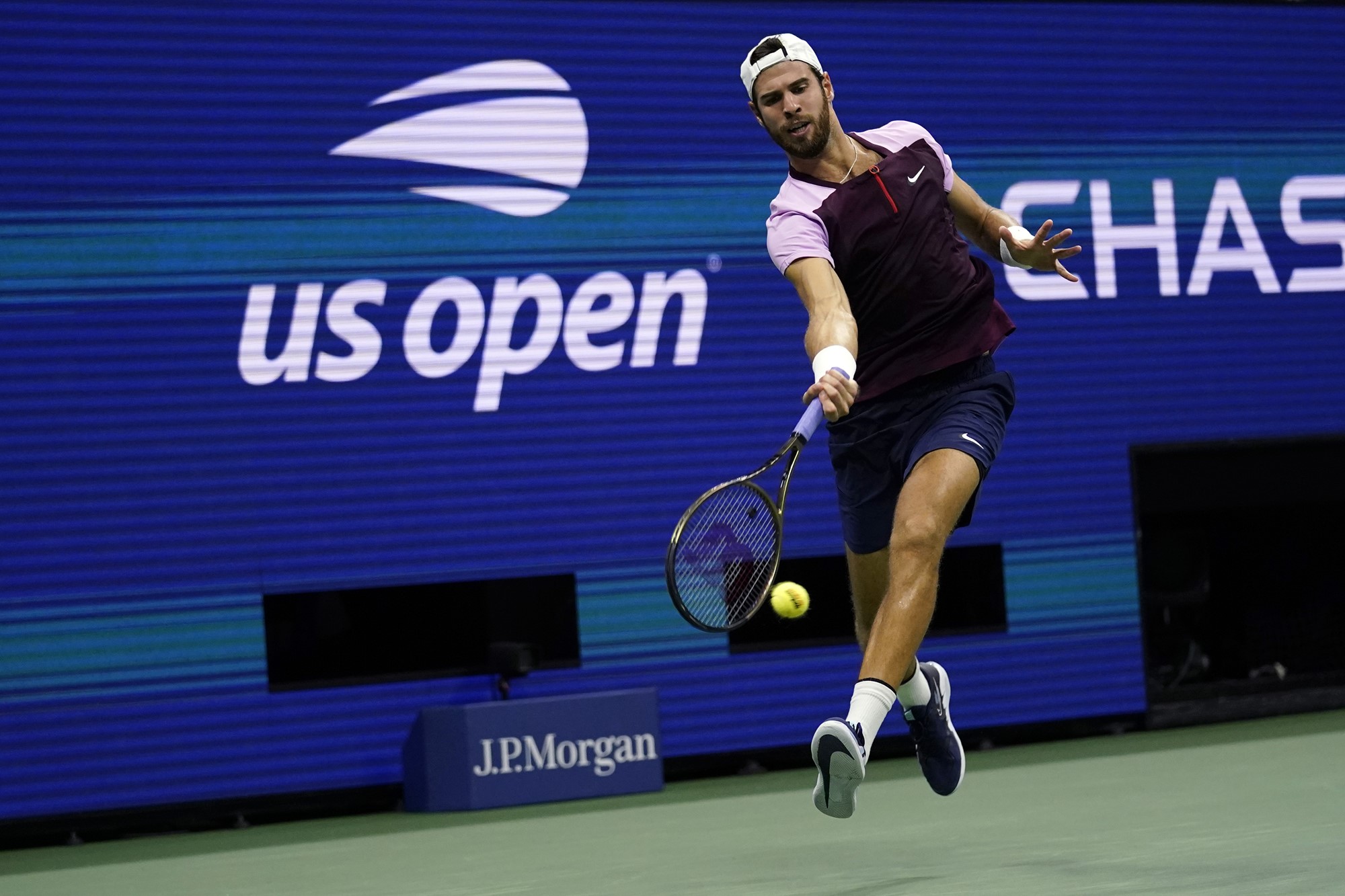 Karen Khachanov hits a forehand at the US Open.