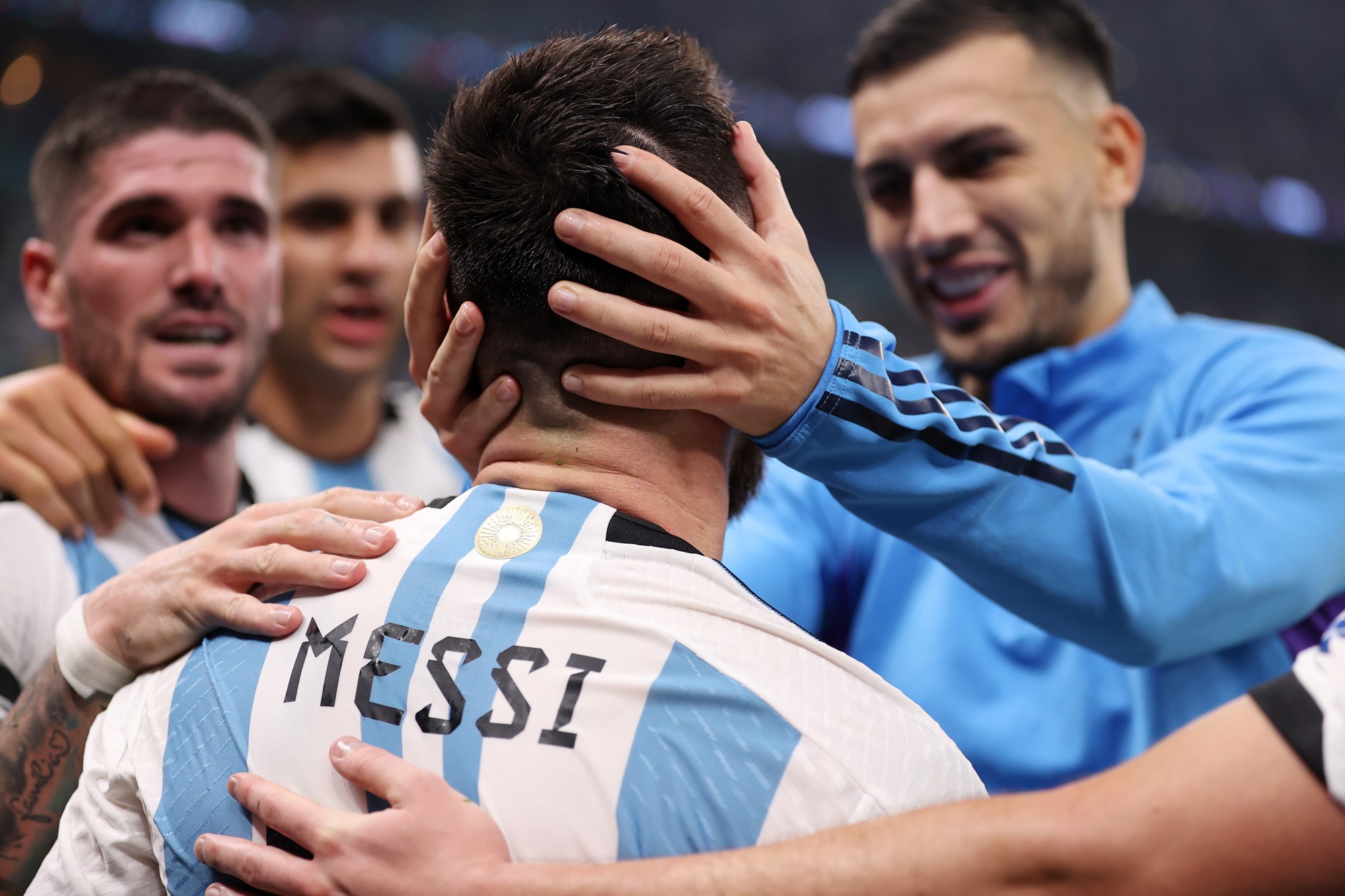 Argentina teammates celebrate with Lionel Messi.