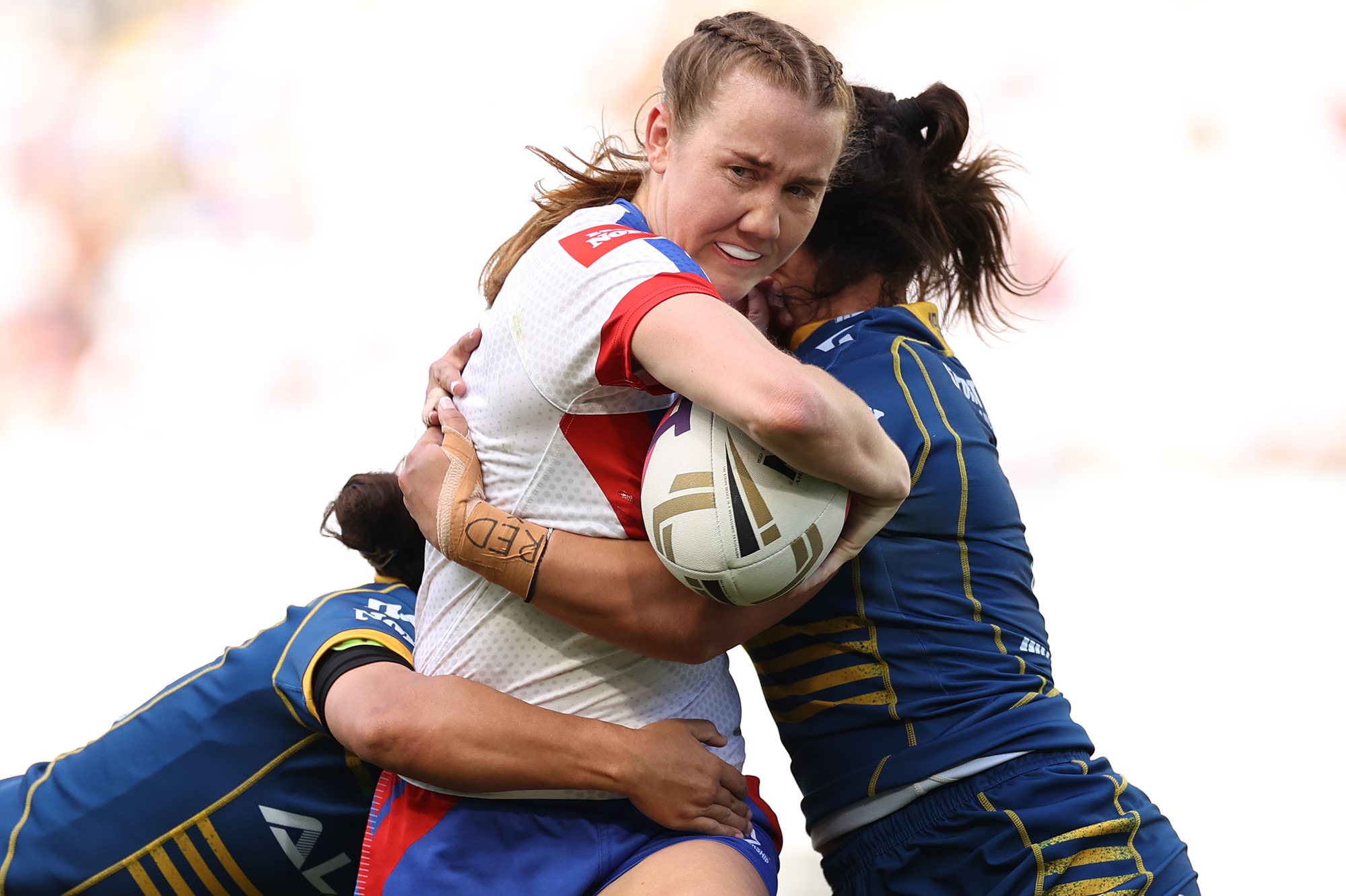 Newcastle NRLW player Tamika Upton runs into the Parramatta Eels defence during the grand final.