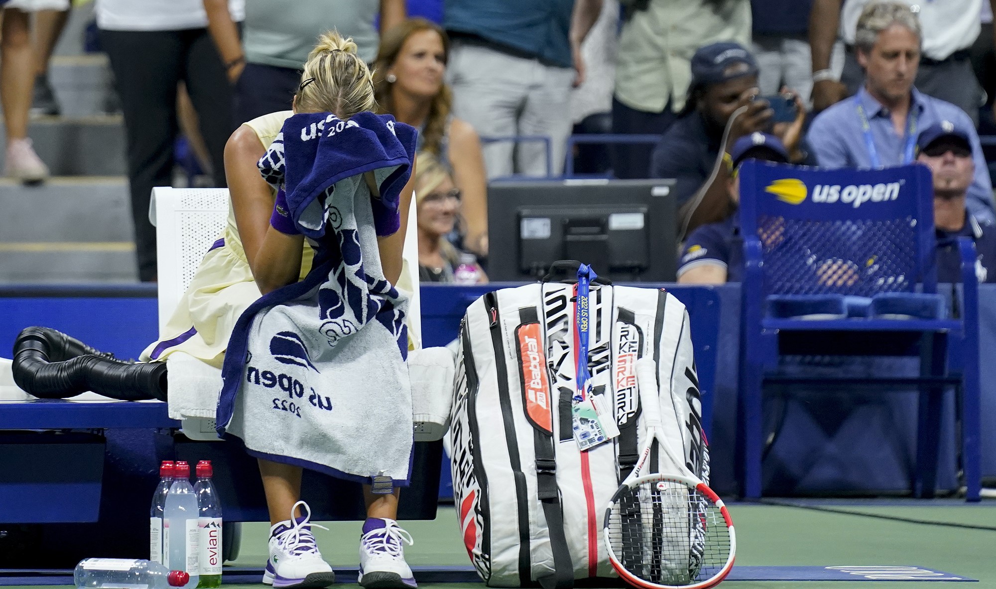 A woman holds a towel in her hand at the US Open.