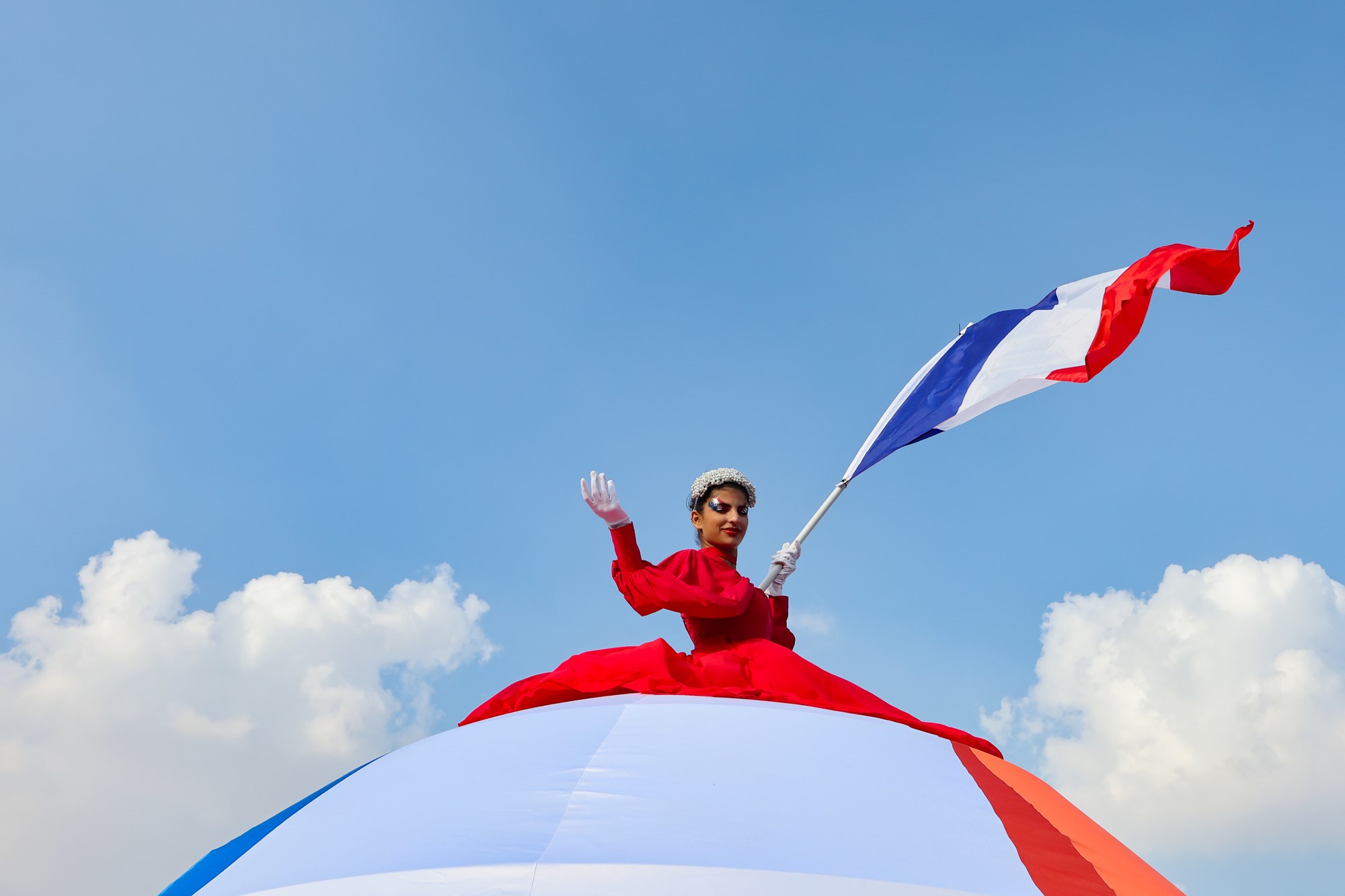 A performer waves a French flag