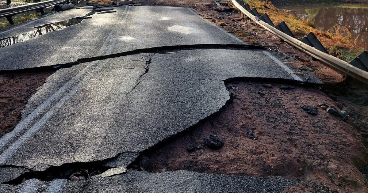 A cracked and destroyed road