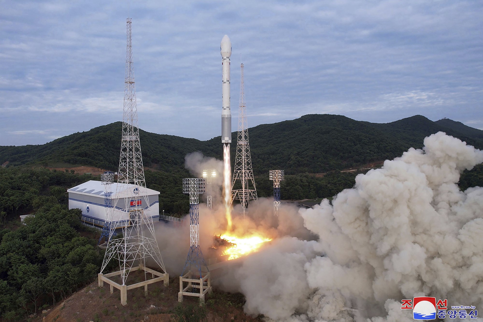 Cloud plumes from a rocket being launched. 