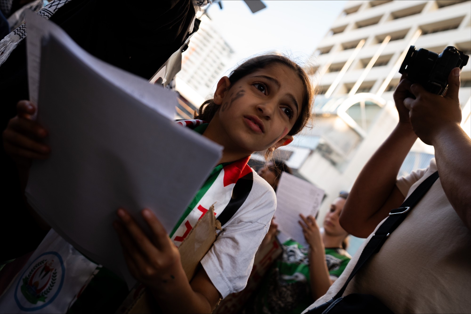 A young girl dressed in Palestine colours.