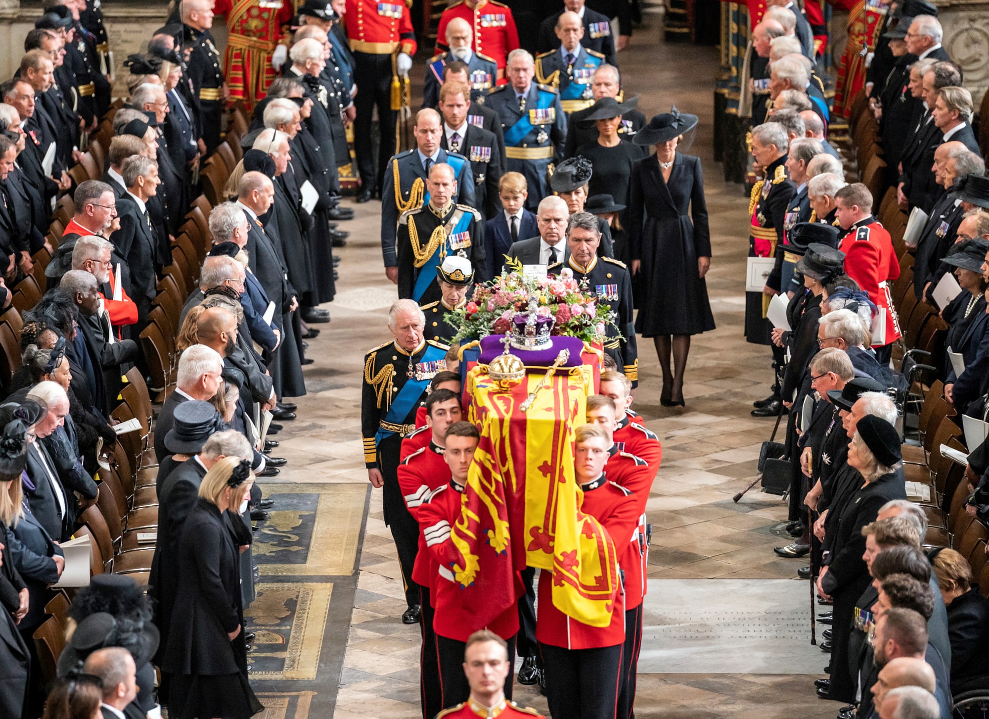 Men carry the Queen's coffin out of Westminster Abbey