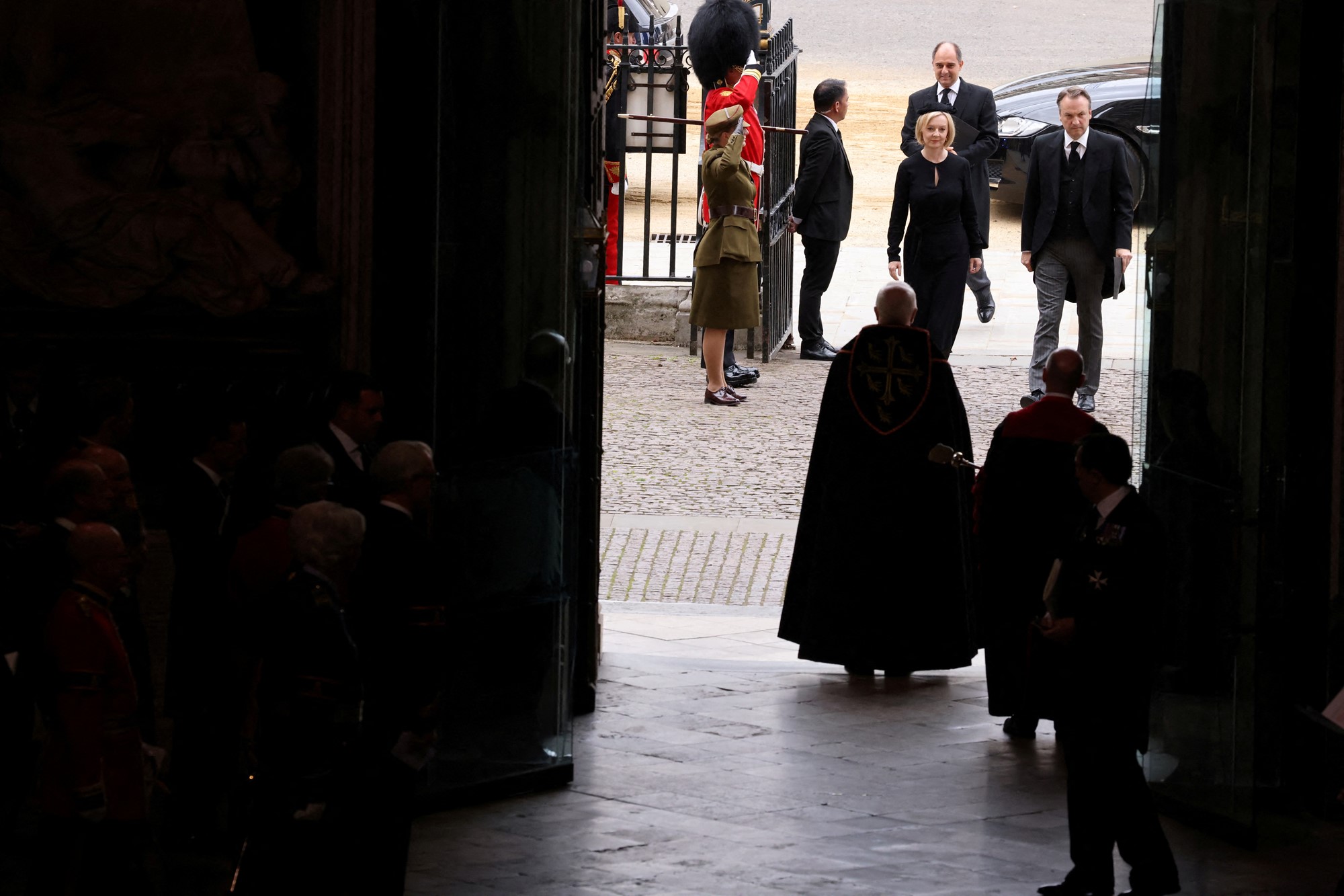 Liz Truss and her husband walk into Westminster Abbey