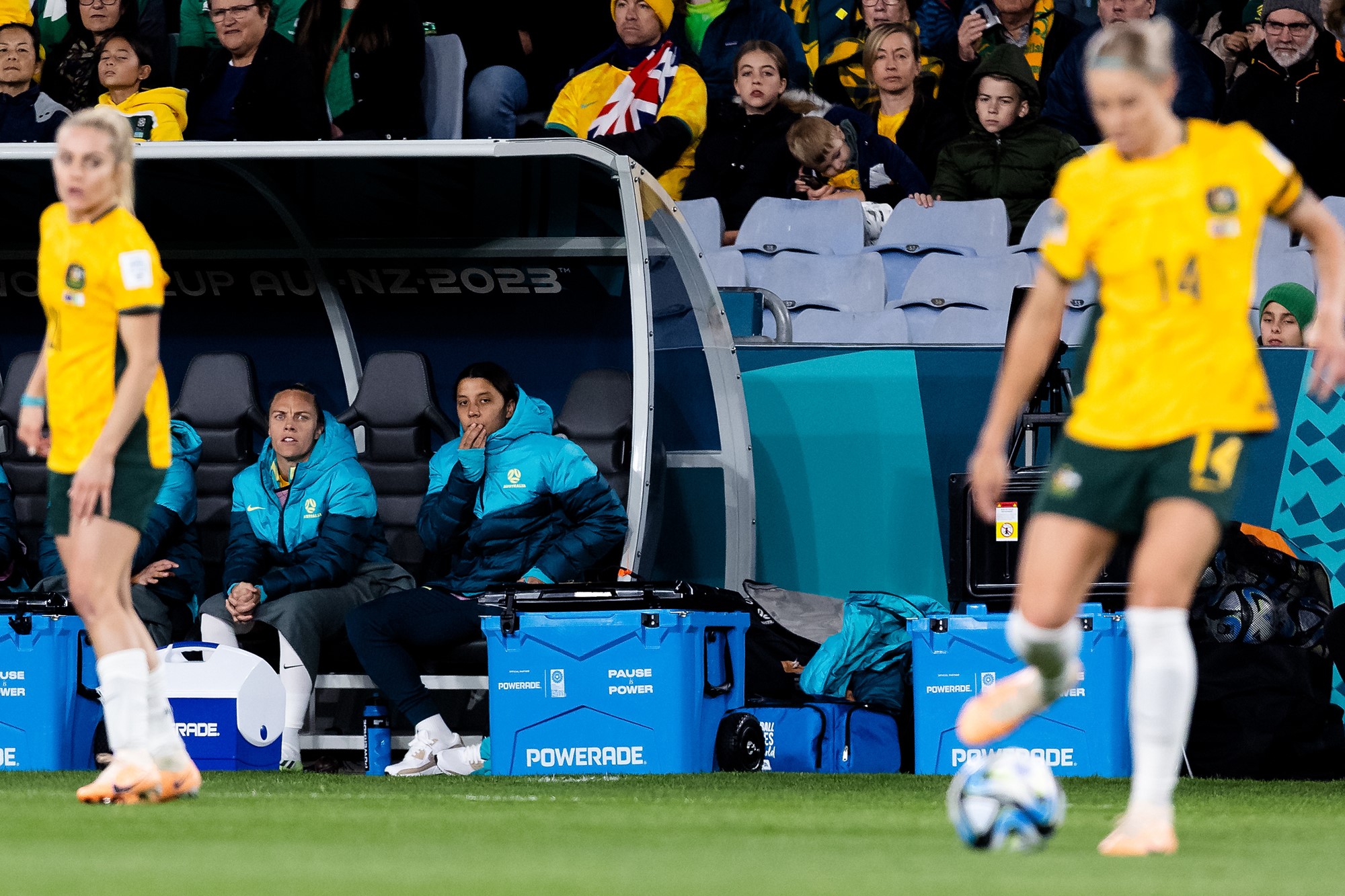 Sam Kerr watches from the bench as the Matildas play.