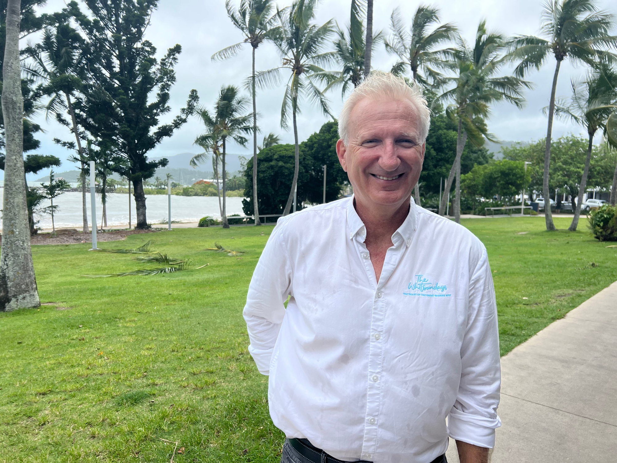 Tourism Whitsundays CEO Rick Hamilton smiles on the strand