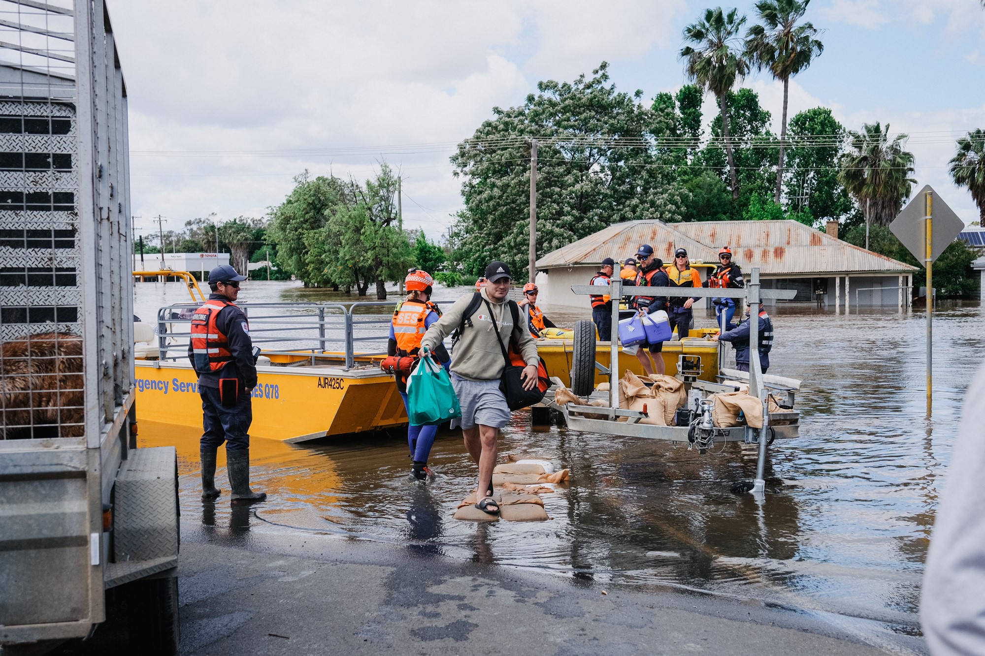 People get off an emergency service boat being used as a ferry