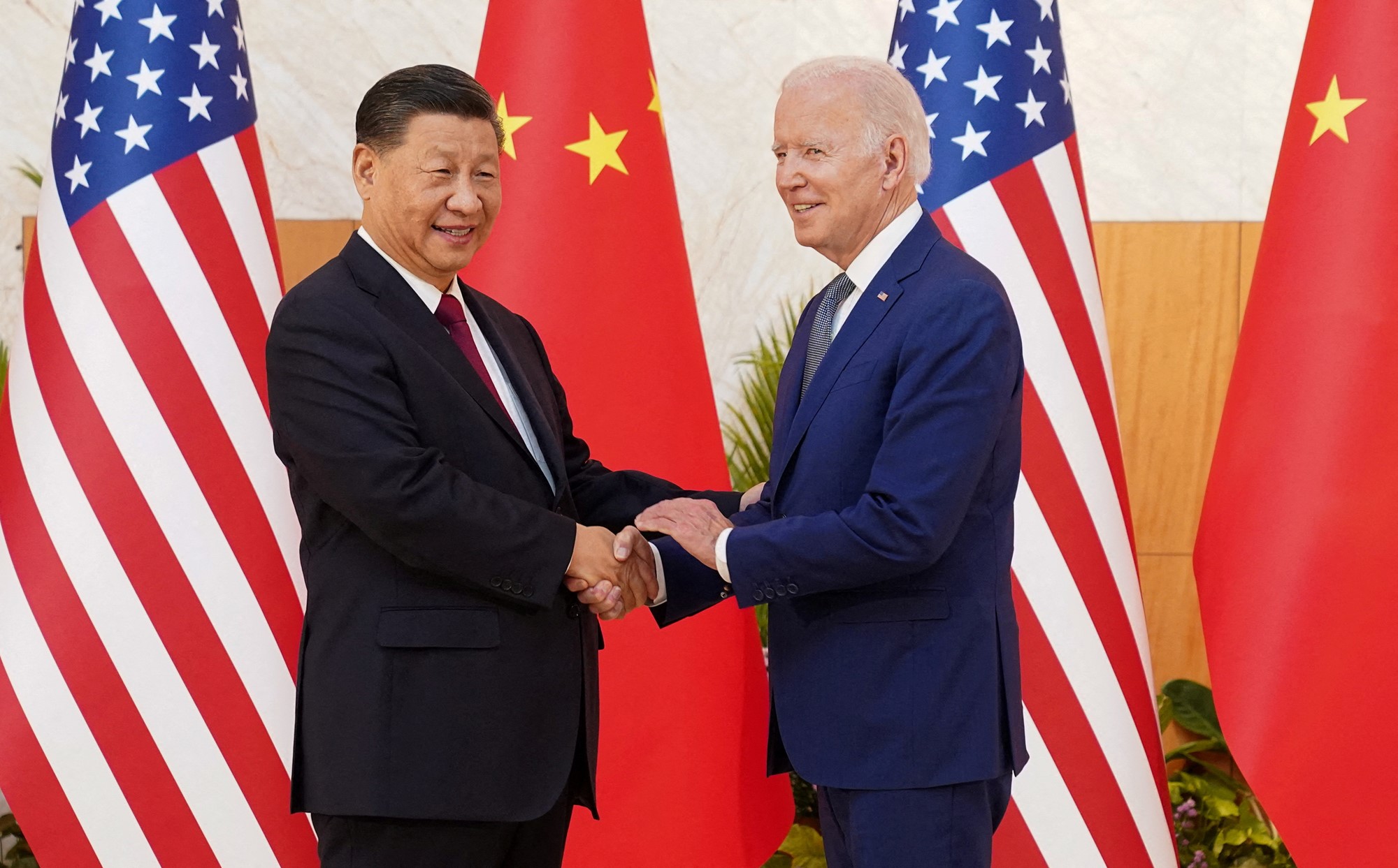 Xi and Biden shake hands.