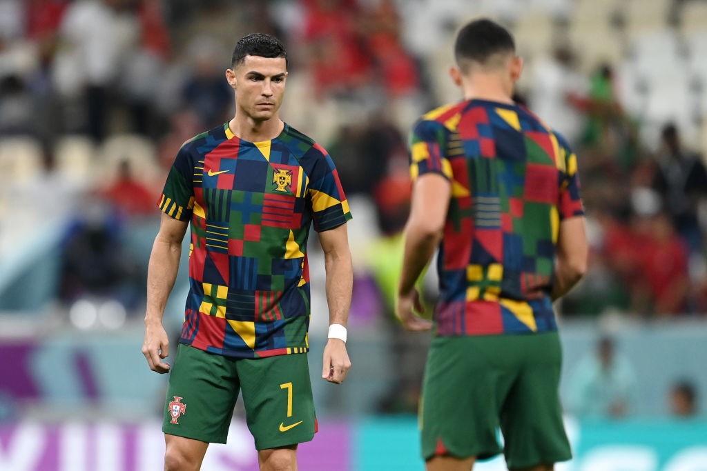 Cristiano Ronaldo on the pitch to warm up with another teammate before Portugal's Qatar World Cup match against Switzerland.