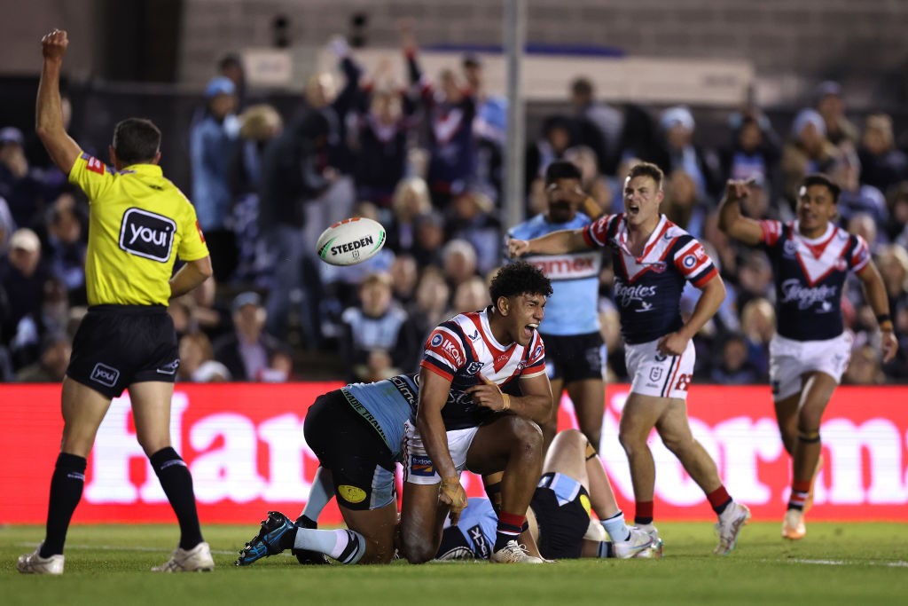 Siua Wong bounces the ball after scoring for the Roosters.