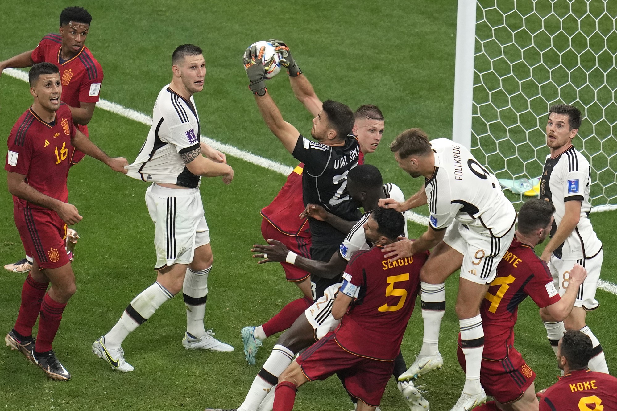 Spanish goalkeeper Unai Simon makes a save from a corner