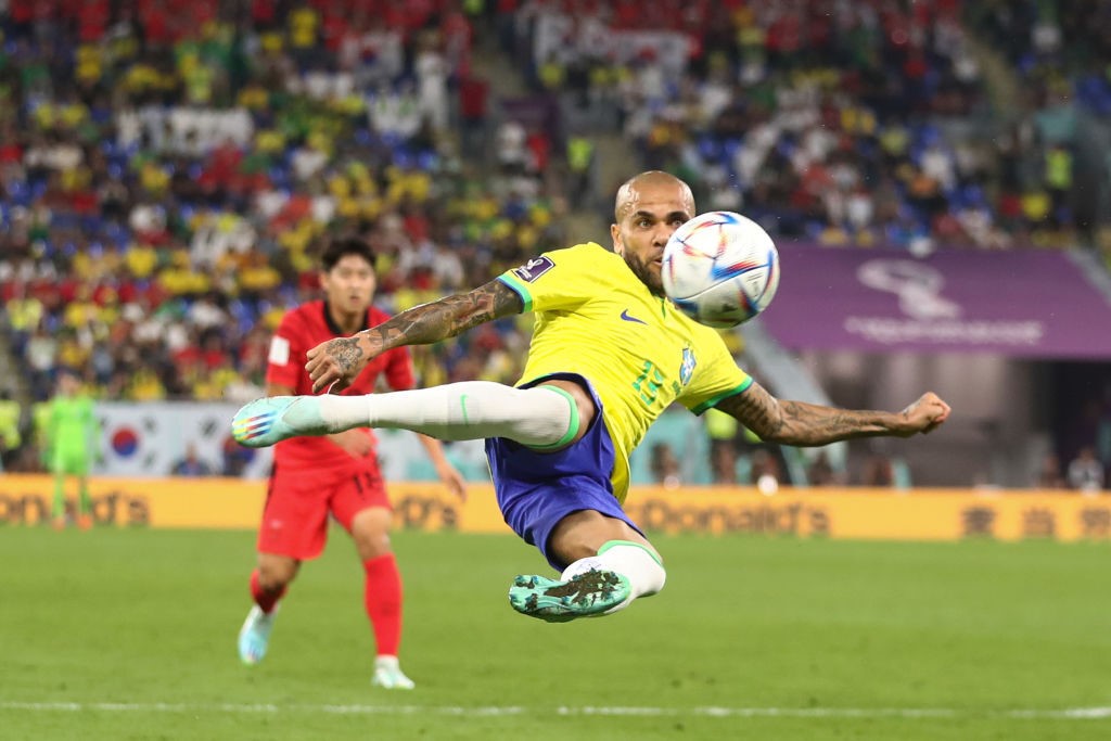 Brazil's Dani Alves tries an aerial strike during a Qatar World Cup match against South Korea.