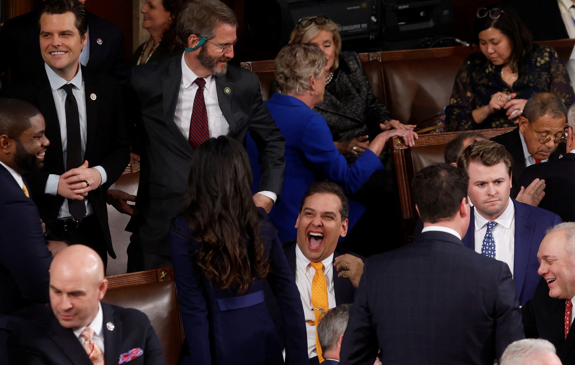 George Santos laughs loudly in the chamber.