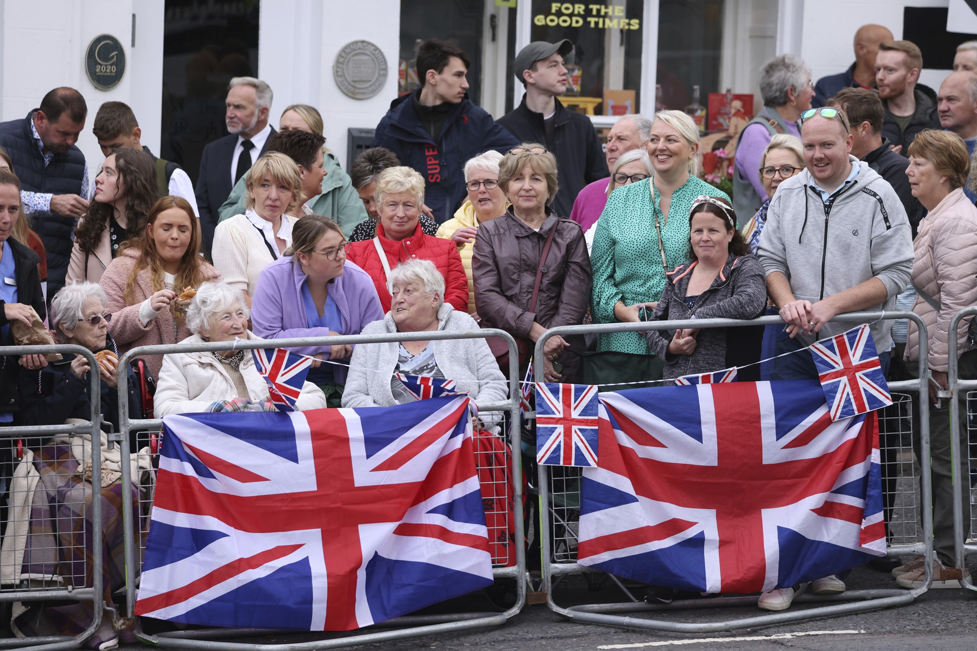 A crowd sit smiling