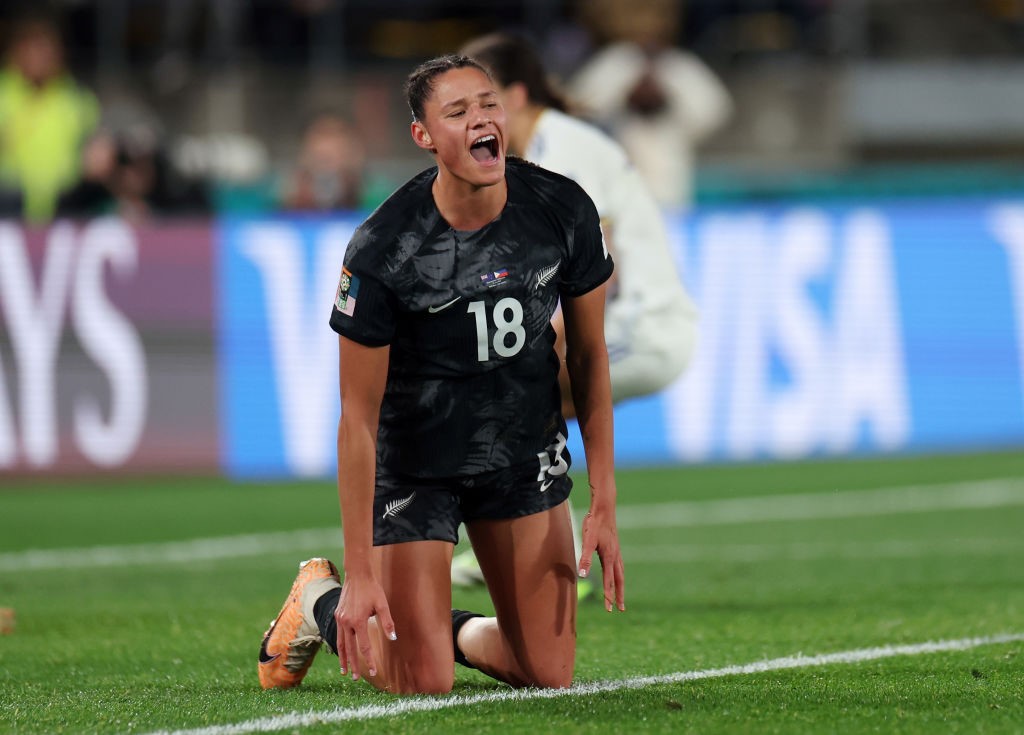 Grace Jale looks miserable on the ground after missing a goal at the Women's World Cup.
