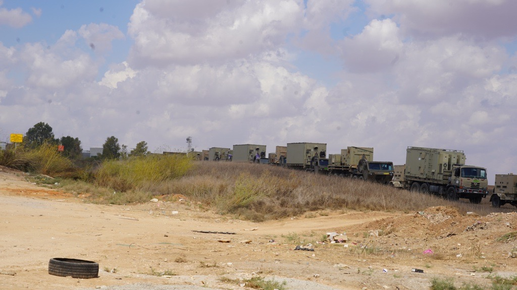 Convoys of trucks line a highway in southern Israel
