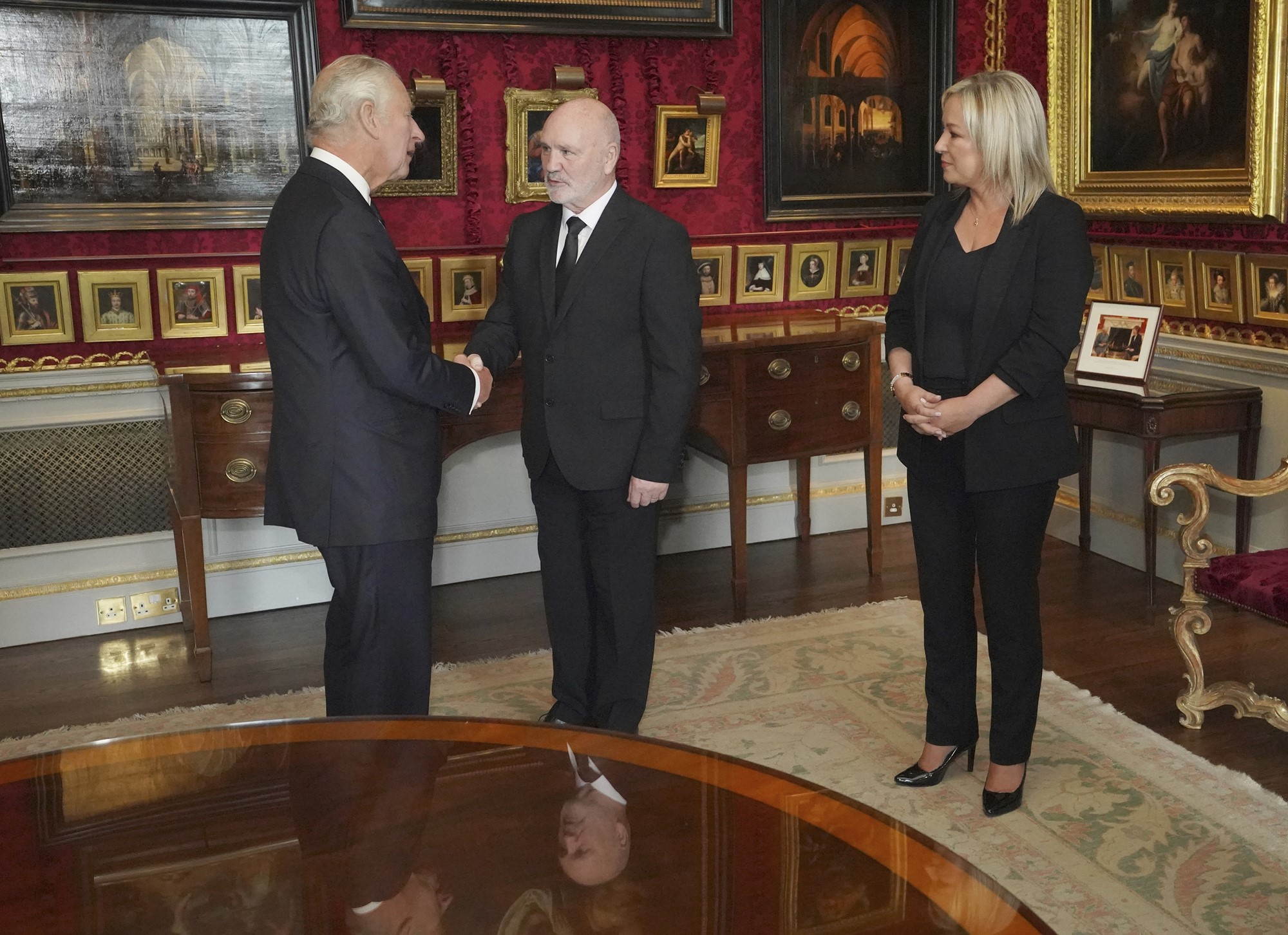 Britain's King Charles III meets Northern Ireland Assembly Speaker Alex Maskey, center, and Sinn Fein Vice President Michelle O'Neill at Hillsborough Castle