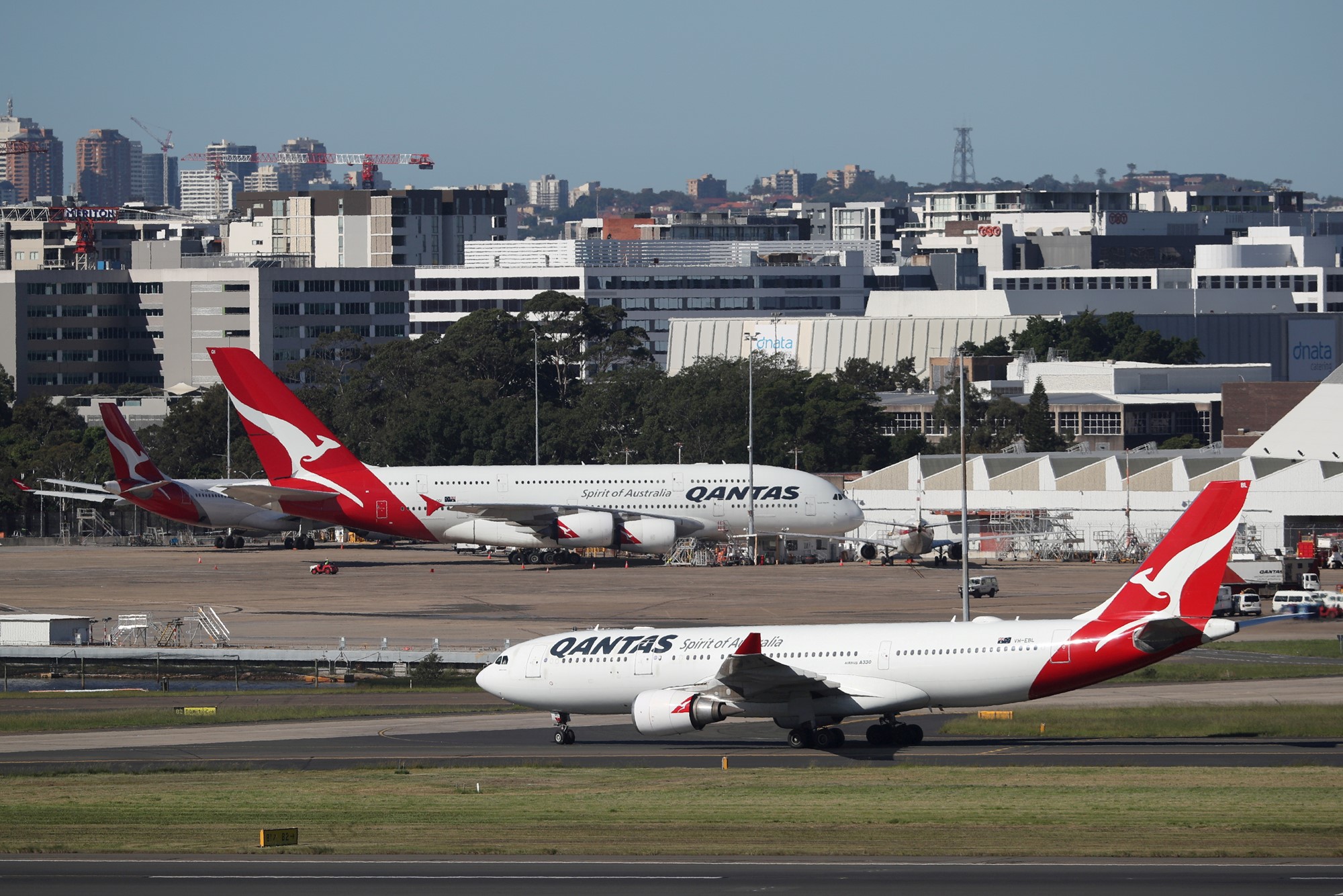 FILE PHOTO: Qantas planes are seen at Kingsford Smith International Airport in Sydney, Australia, March 18, 2020.