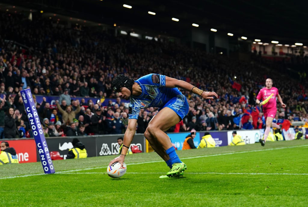 Stephen Crichton grounds the ball for a try for Samoa.