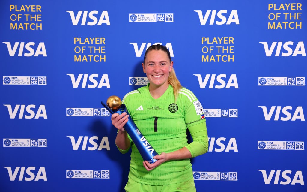 Philippines goalkeeper Olivia McDaniel holds a trophy as player of the match in the Women's World Cup against New Zealand.