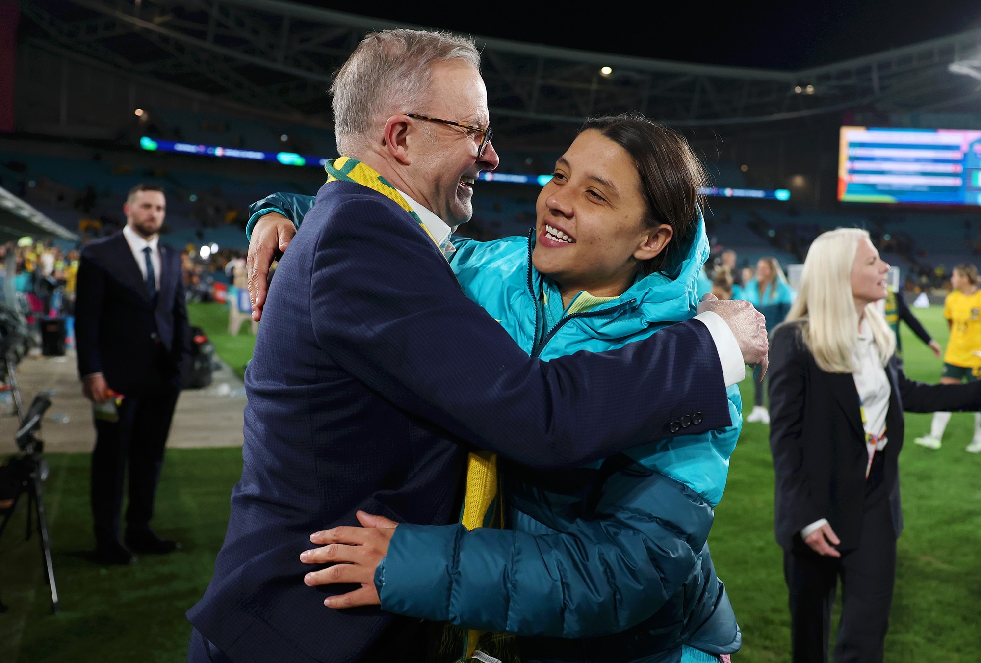 Albanese and Kerr go in for a hug on the field.