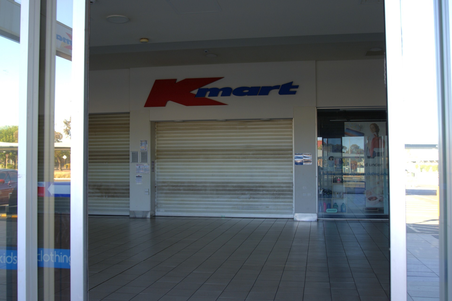 A closed shop front of a Kmart store
