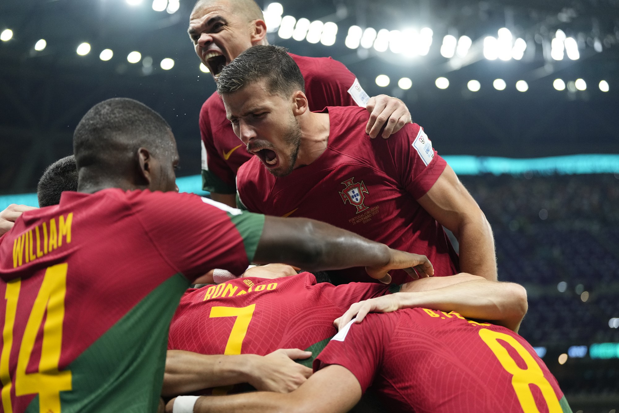 Bruno Fernandes and Portugal players celebrate with Cristiano Ronaldo after a goal