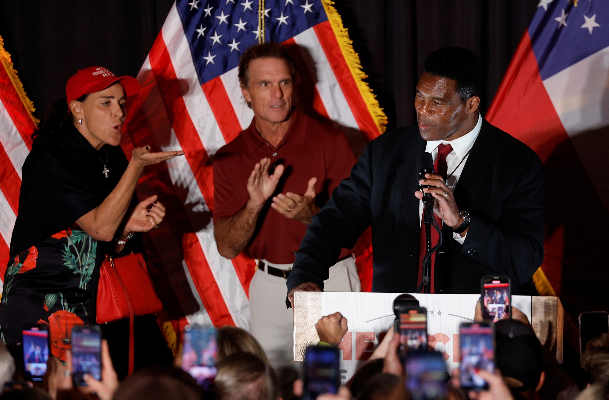 Republican Georgia U.S. Senate candidate Herschel Walker speaks next to his wife Julie