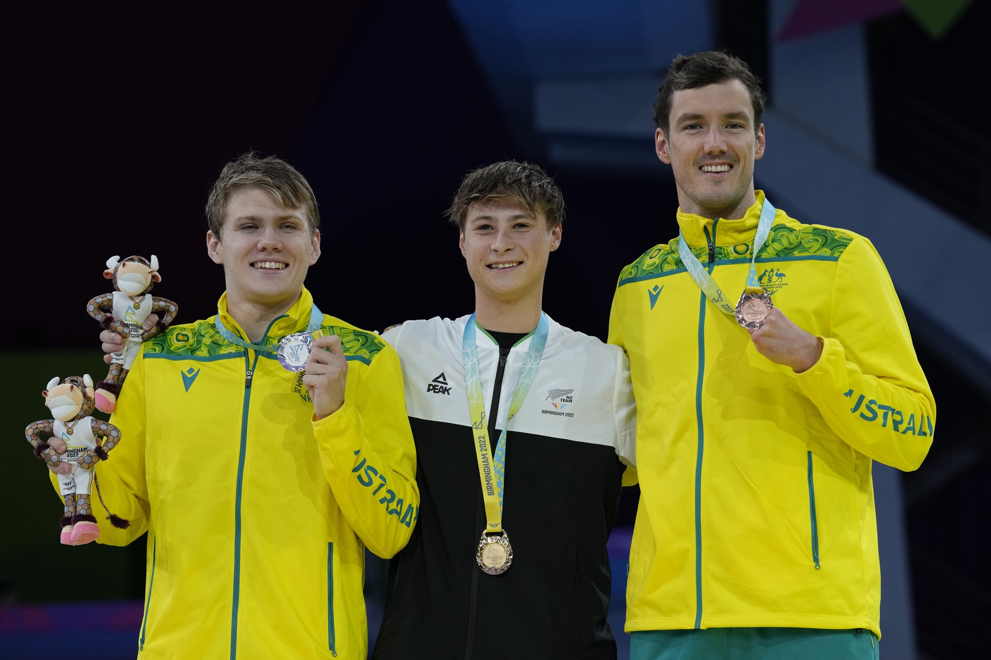 New Zealand's Joshua Willmer, centre , gold, with Australia's Timothy Hodge, left, silver and Australia's Blake Cochrane, bronze stand on the podium during the medal ceremony