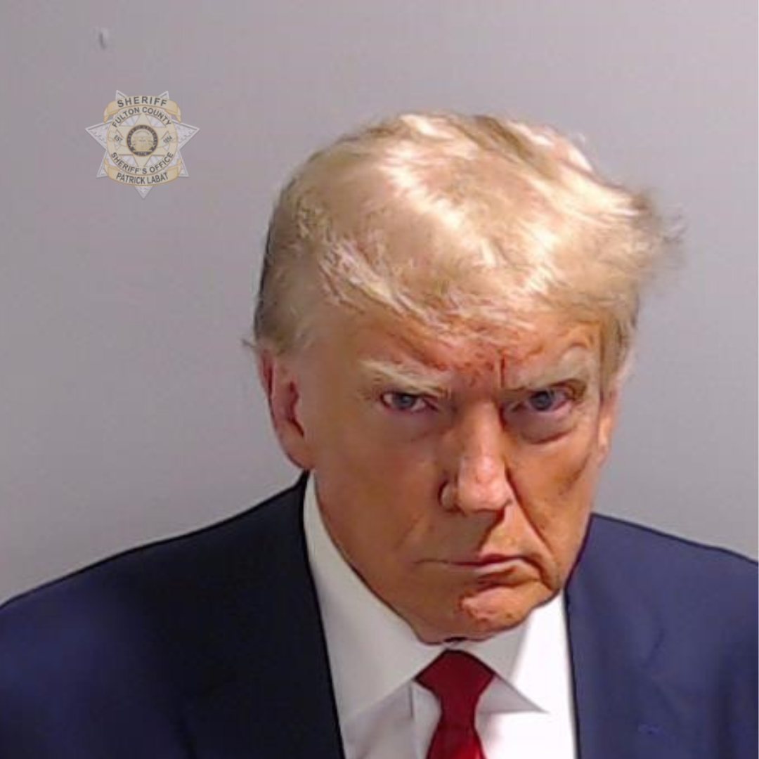 Donald Trump looking stern at camera in mugshot