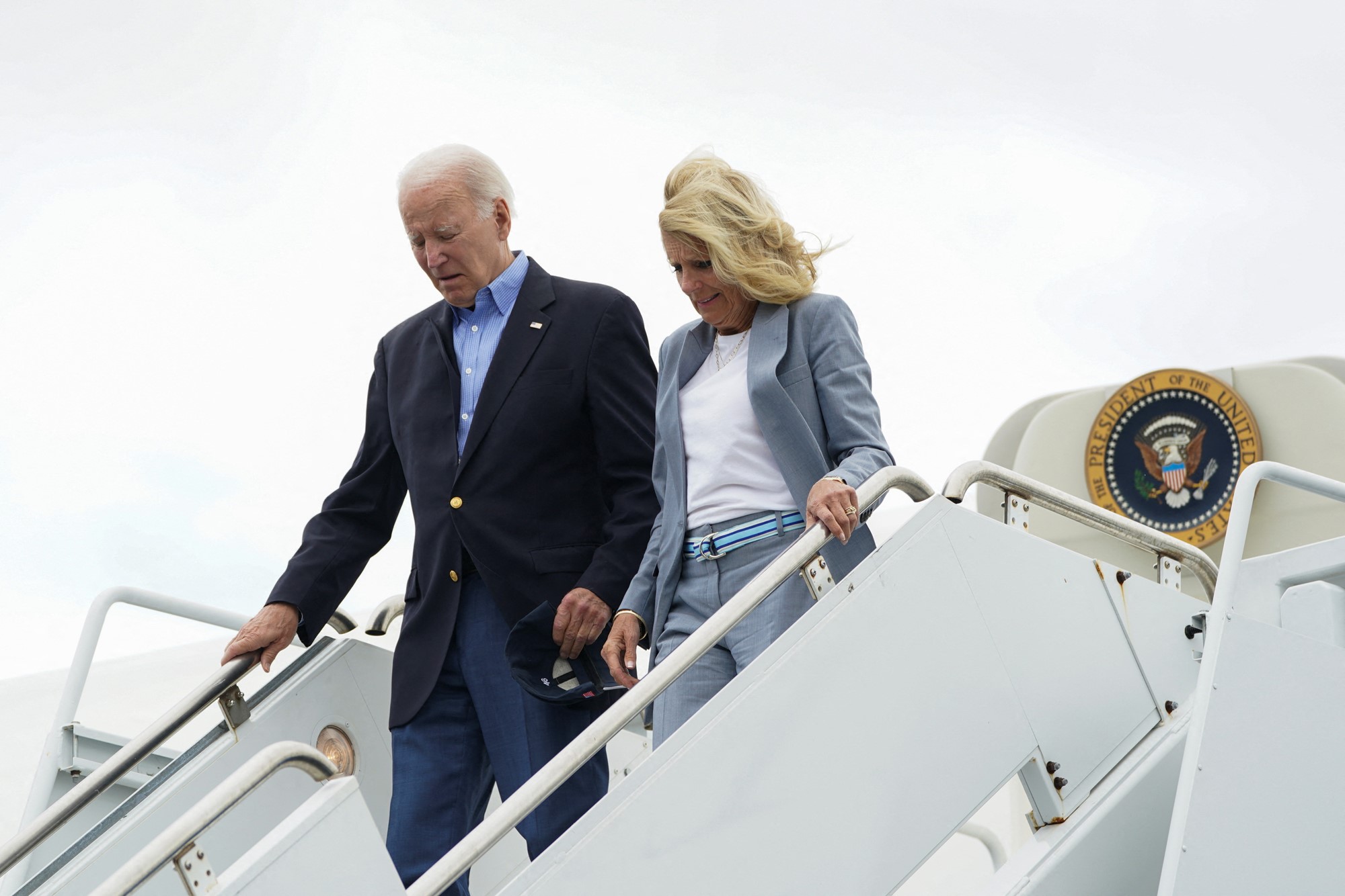 President Joe Biden and first lady Jill Biden walking off plane.