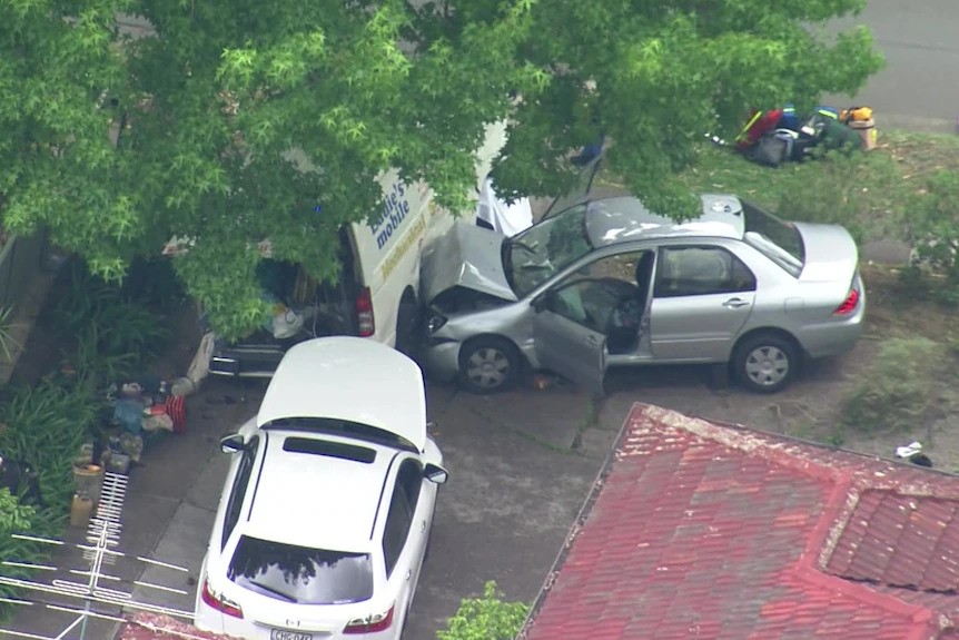 Aerial photo of a car after it crashed into a van on the side of a road