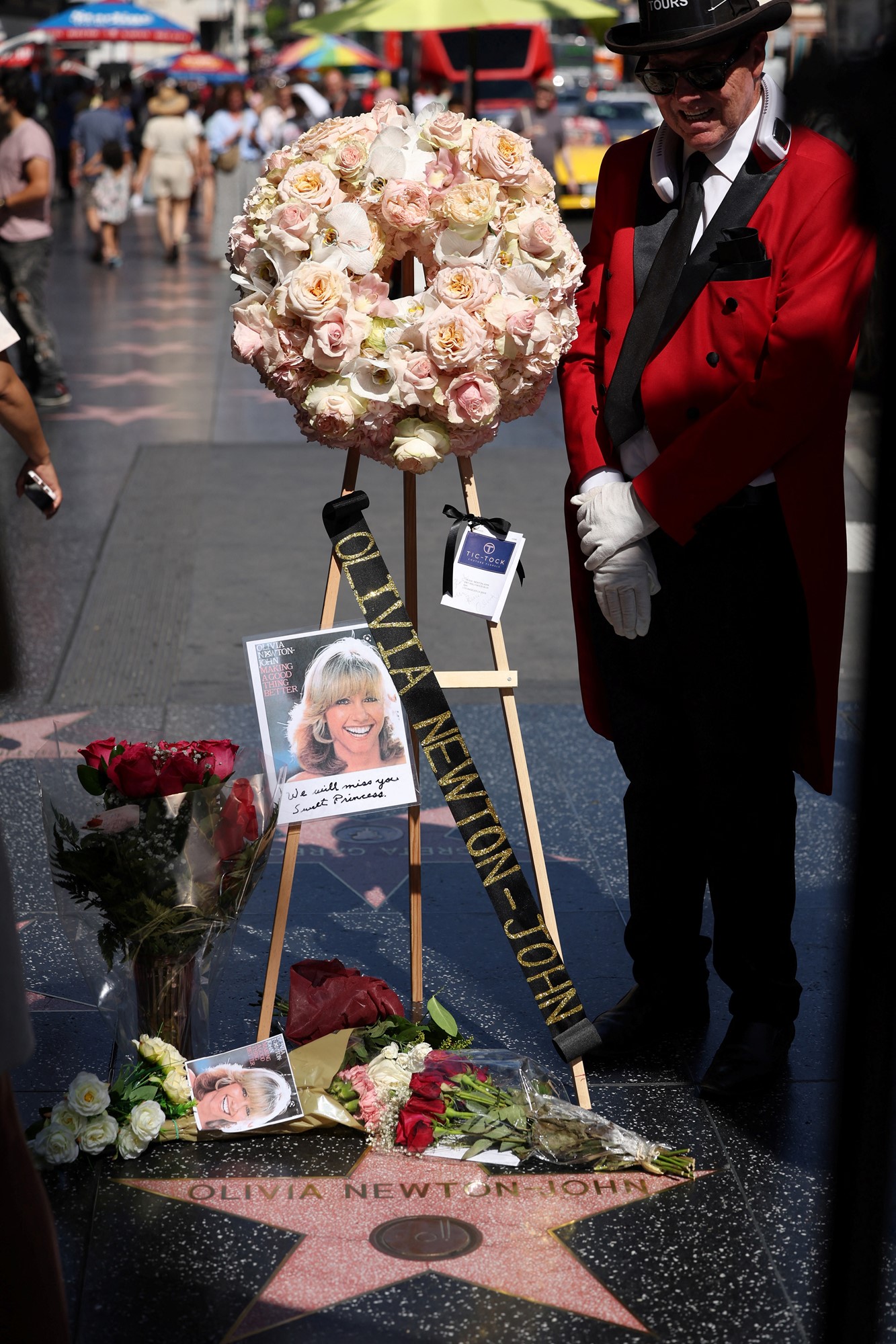 A wreath of flowers istands above Olivia Newton-John's star