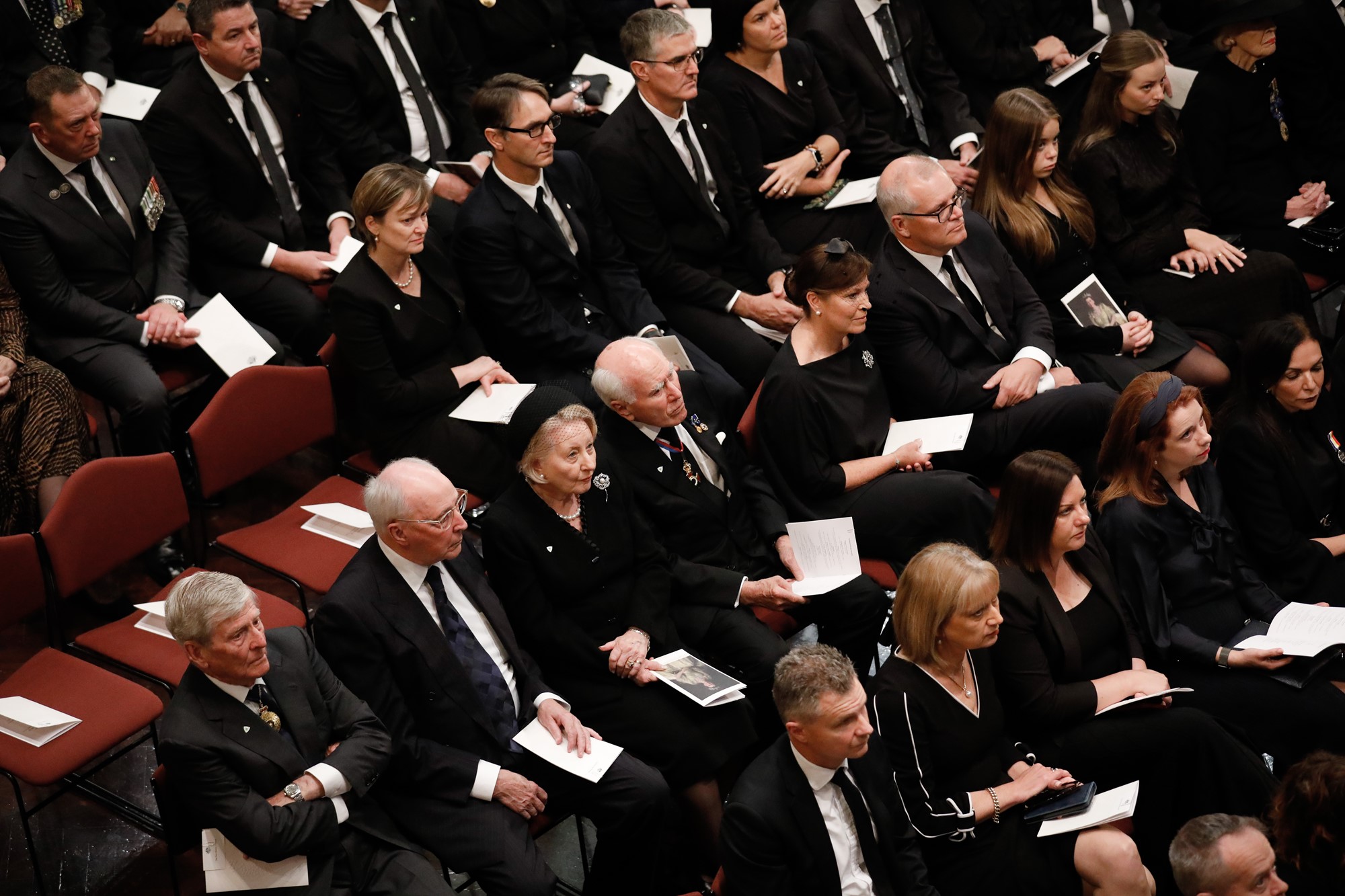 People sit in the Great Hall at the Queen's memorial service.