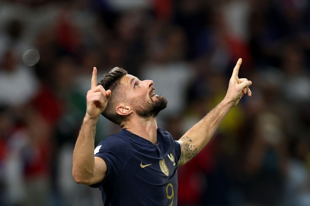 Olivier Giroud points to the sky after scoring for France against Australia in the Qatar World Cup.