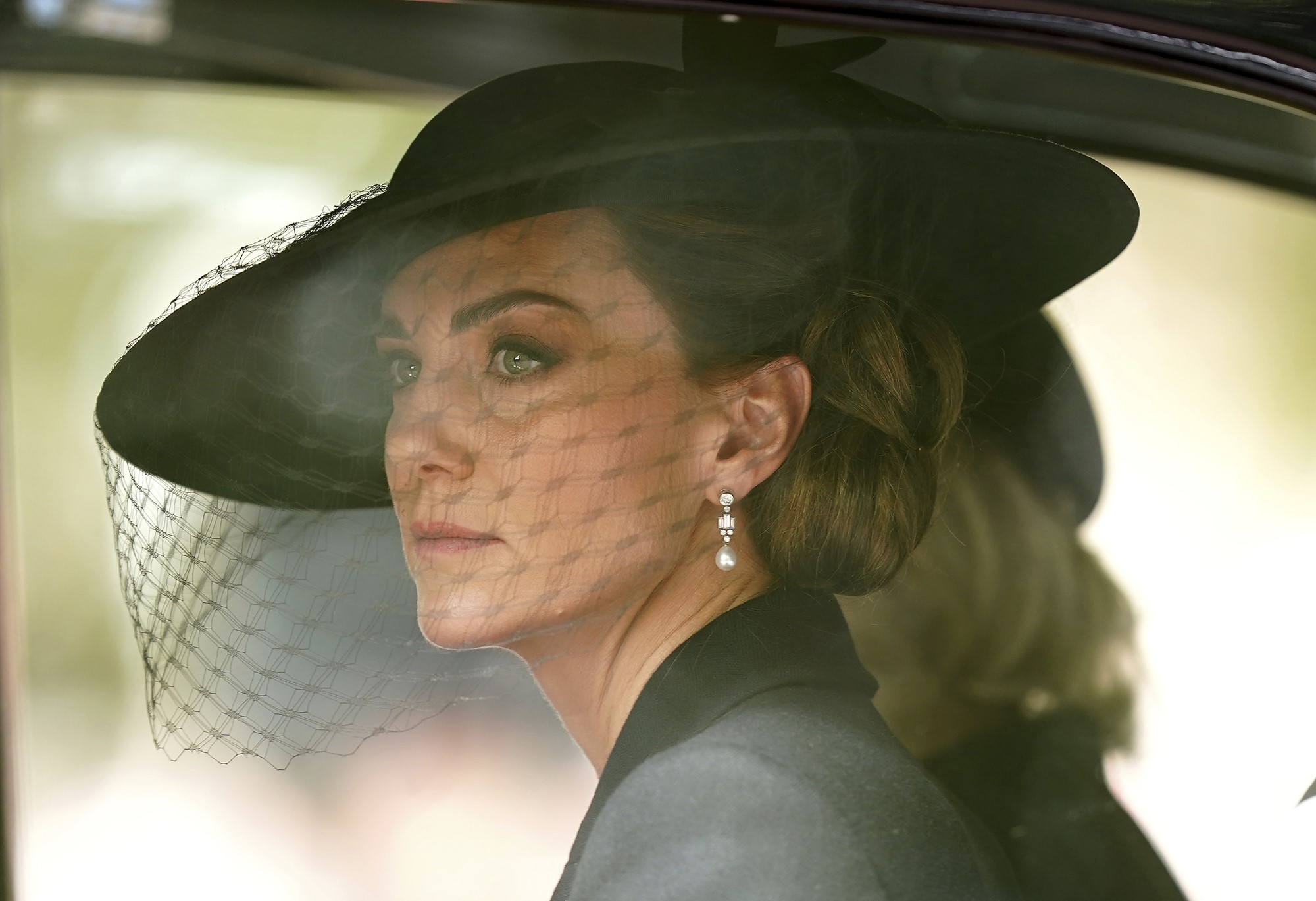 Princess Catherine looks out a car window