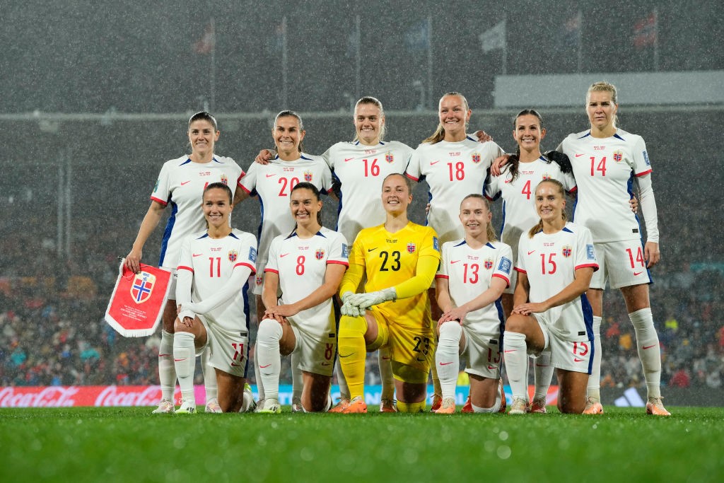 Norway poses for a team photos in the rain before a FIFA Women's World Cup game against Switzerland.