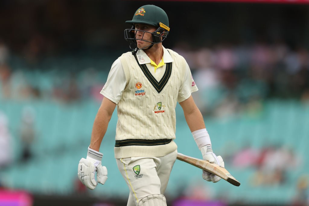 Australia batter Marnus Labuschagne walks off the field with his bat in his hand during a Test against South Africa.
