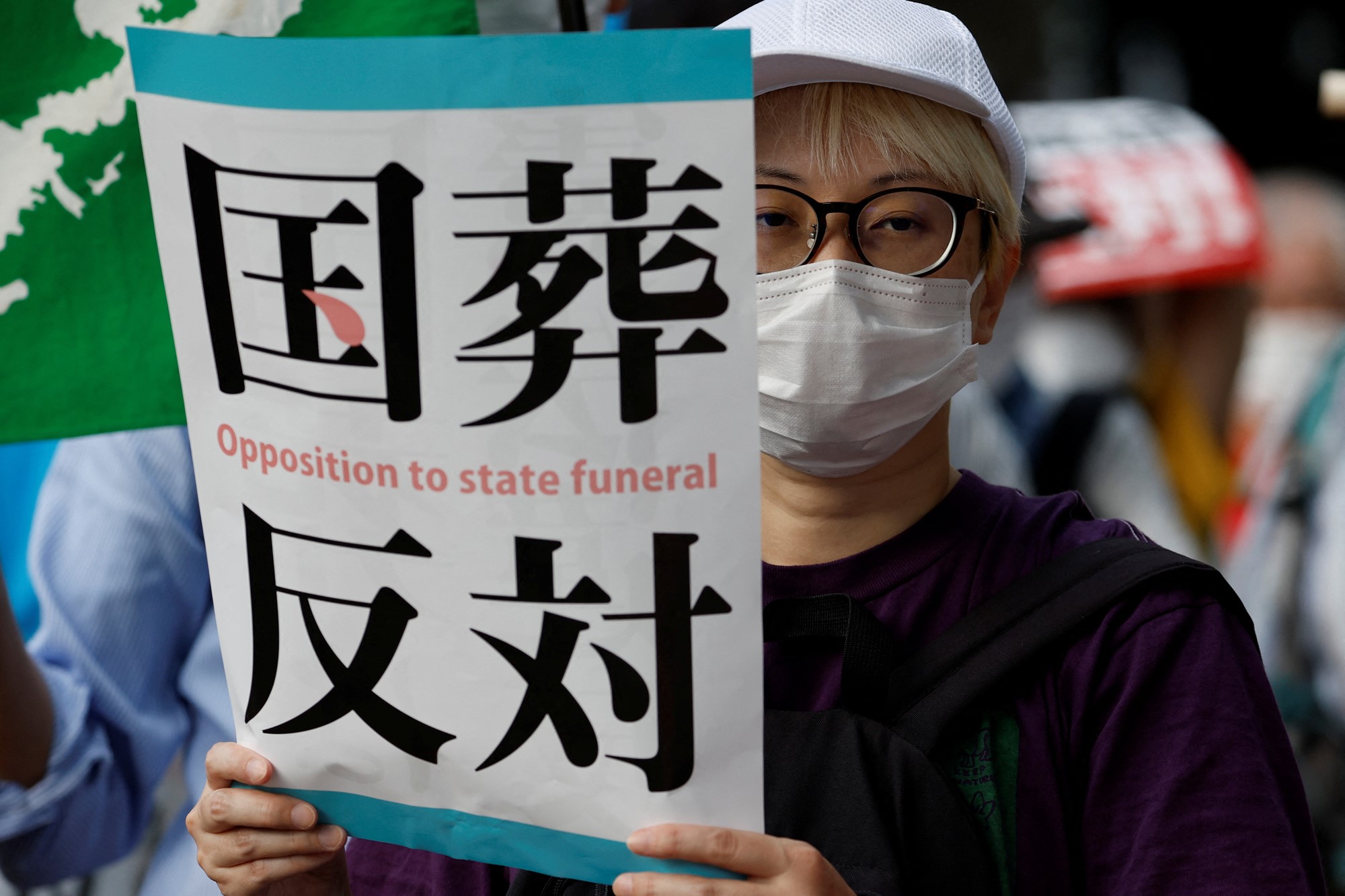 Protesters attend a rally outside the parliament building against Japan's state funeral for former Prime Minister Shinzo Abe