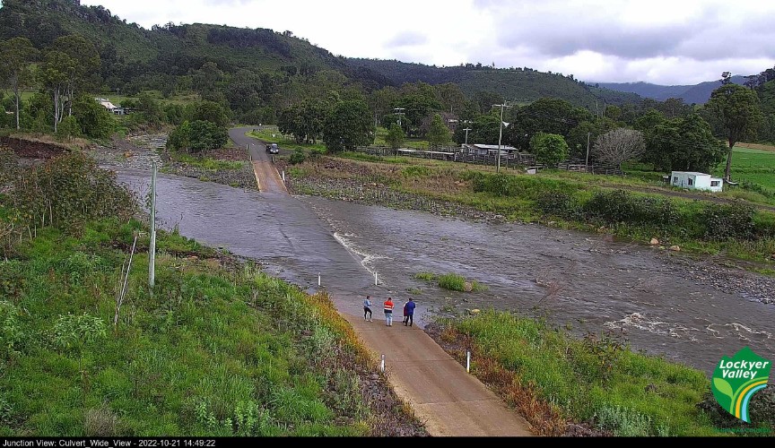 Water inundates a previously accessible road in the Lockyer Valley.